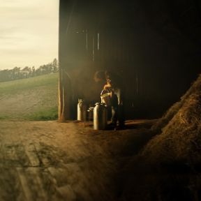 all_about us hub_farmer in satble_triptych_intro hub_big.jpg